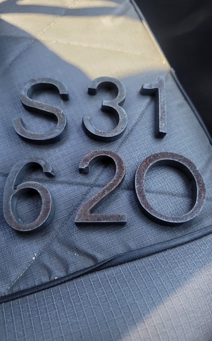 Finished laser-cut metal house numbers and letters